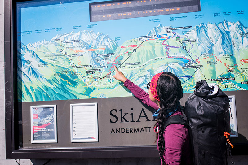 Jessie pointing at the cable car picture at the Gütsch Express